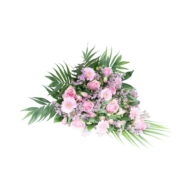 En klassisk lyserøde bårebuket med roser og gerbera